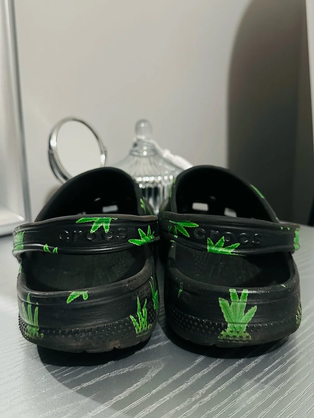 CROCS Black Slip-On Clogs with Green Leaf Print